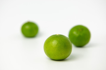 Limes with slices isolated on white background