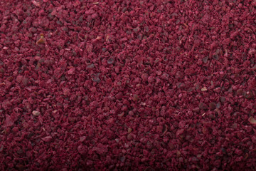 dried pomegranate seeds powder background