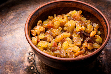 Ceramic bowl with raisins