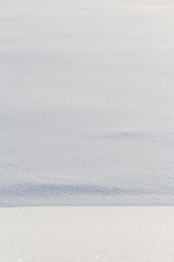 vertical background of fresh snow. winter field