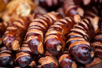 Delicious grilled sausages. Street festival food. Close-up