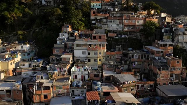Favela Aerials: Slow move up favela mountainside houses in Rio de Janeiro, Brazil