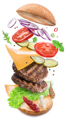 Hamburger ingredients falling down one by one to create a perfect meal. Colorful conceptual picture...