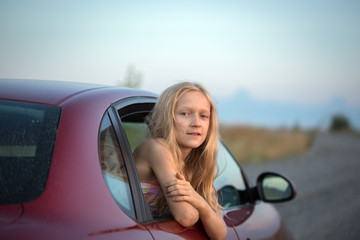 girl looking out the car