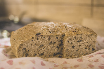 Sliced homemade brown bread.Defocus in the background.