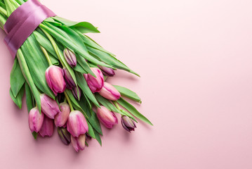 Bouquet pink tulips on lightpink background.