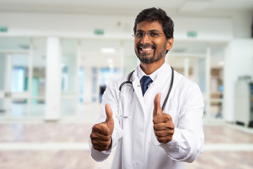 Obraz premium Medic making like gesture holding up two thumbs.