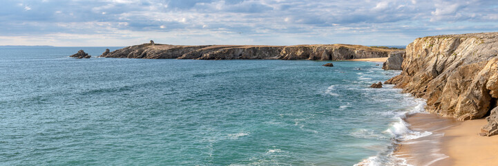 French landscape - Bretagne. A beautiful beach with wild cliffs in the background. Panoramic view.