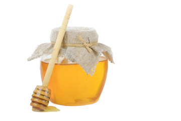 jar with honey with wooden spoon with copy space isolated on white background