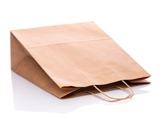 One Empty Brown Paper Bag. Recycled paper Shopping Bag isolated on white background.
