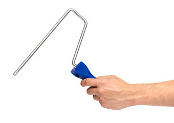 Close up view of Worker Man Hand with Paint Roller Brush. Male Hand with Tools. Human hand holding new Roller, isolated on white background.