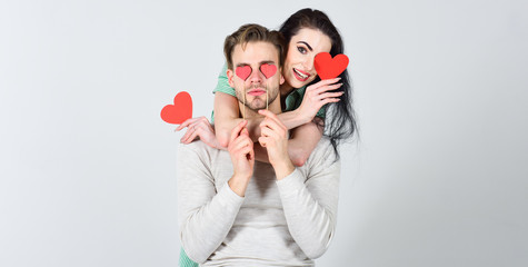 Romantic ideas celebrate valentines day. Man and woman couple in love hold red heart valentines cards white background. Man and pretty girl in love. Valentines day concept. Valentines day and love