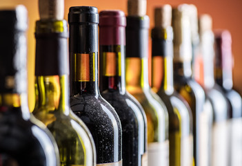 Line of wine bottles. Close-up.