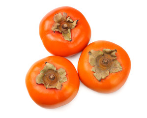 fresh ripe persimmons isolated on white background. top view