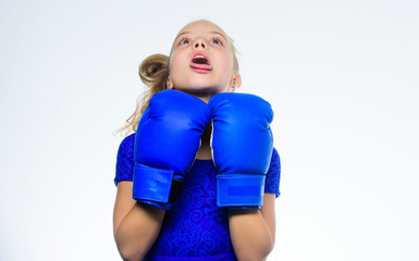 Be strong. Sport upbringing. Upbringing for leadership and winner. Strong child boxing. Sport and health concept. Boxing sport for female. Girl child with blue gloves posing on white background