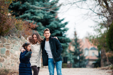 Fototapeta premium Happy family mother and children walk in park.