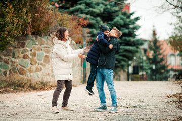 Obraz premium Happy family mother and children walk in park.