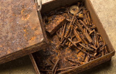 iron box with rusty nails