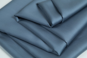  Blue Fabric for a decor and an interior is put  by decorative spiral folds