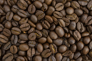 Roasted brown coffee beans, can be used as a background and texture