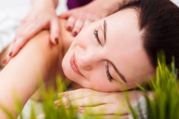 Obraz na płótnie Canvas Smiling client at a massage session