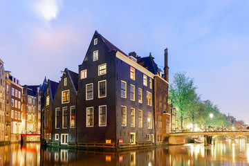 Fototapeta na wymiar Beautiful houses by the canals in Amsterdam, Holland