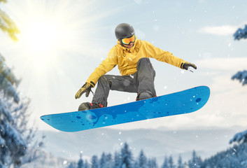 Fototapeta na wymiar Snowboarder jump