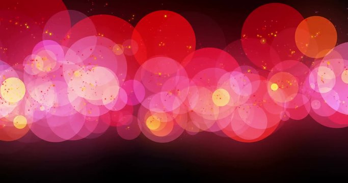 Abstract background with soft circle bokeh defocused and blurred on black background. Red and yellow and shiny bubbles animated in group floating