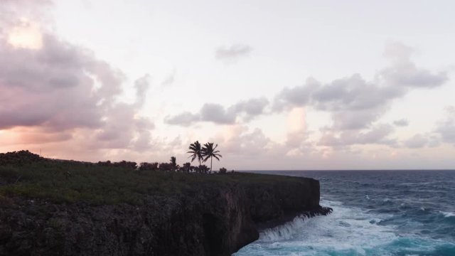 Timelapse of the waves crashing against the cliff at sunst in the Dominican Republic.
