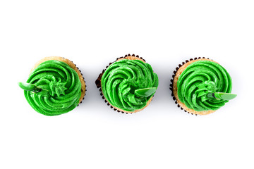 St. Patrick's Day cupcakes isolated on white background. Top view