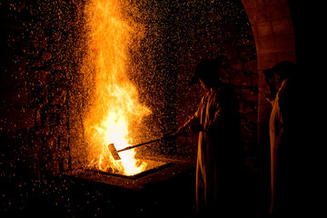 .Blacksmith forging in the traditional way, as in the past