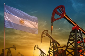 Argentina oil industry concept. Industrial illustration - Argentina flag and oil wells against the blue and yellow sunset sky background - 3D illustration