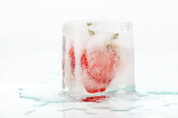 Frozen strawberry isolated on white background
