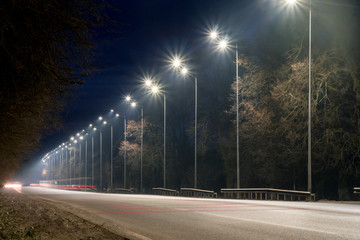 street lighting, supports for ceilings with led lamps. concept of modernization and maintenance of lamps, place for text, night. winter season. energy-saving lamps, safety of movement