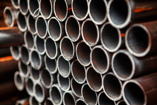 stack of empty steel pipes