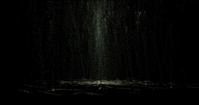 Golden dust and light falling from top to bottom on a black background. Bright and luminous rain of particles.