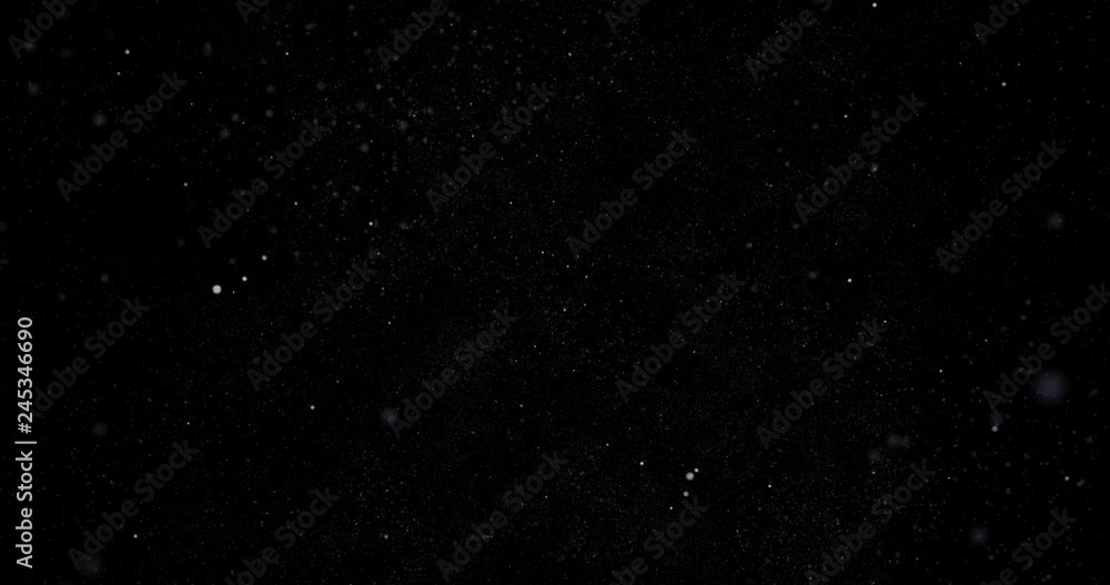 Poster particle system of powders moving in the black space, lights and granular elements collected in a cl