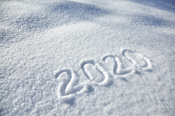 winter inscription 2020 New Year background, text on snow surface