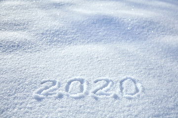 Inscription date 2020 New Year winter background, text on snow surface