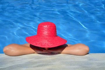 Real female beauty relaxing in swimming pool