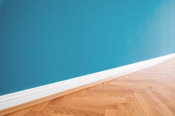 wall blue painted and wooden parquet floor background