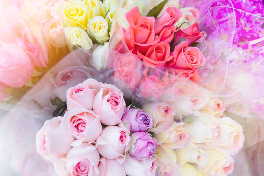 Blurred colorful bouques rose flowers blossom in fresh flower shop background with vintage filter.