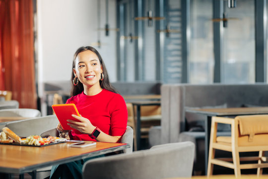 Young businesswoman reading her e-mail on the tablet