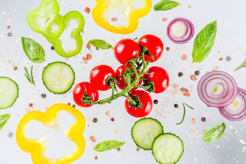 Vegan healthy food concept. Ingredients cooking spring vitamin salad. Fresh vegetable simple pattern, layout with tomatoes, onions, herbs and spices on white background. Top view banner copy space