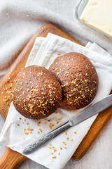 Homemade rye buns with linseeds, sesame and white poppy seeds
