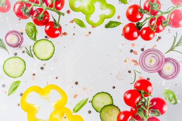 Vegan healthy food concept. Ingredients cooking spring vitamin salad. Fresh vegetable simple pattern, layout with tomatoes, onions, herbs and spices on white background. Top view banner copy space