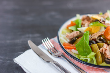 Nicoise salad with tuna, green beans, basil and fresh vegetables