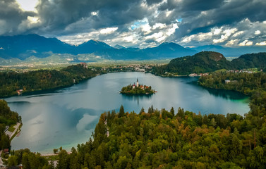 Fototapeta na wymiar Aerial view of Bled lake near the Bled town in Slovenia. National park Triglav, part of Alps mountains called Julian Alps.
