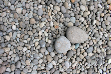 Big stones among smaller pebbles, in the garden.