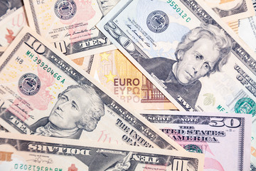 Closeup lot of american dollar and euro cash banknotes. Concept leap, fall, rate, currency exchange, debt, profit, loss, sanctions, appreciation of goods